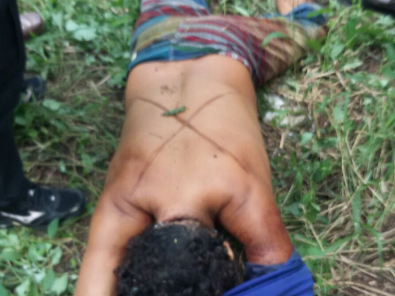 Corpo estava marcado com um 'X' (Foto: Divulgação/Polícia Militar)
